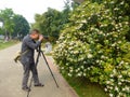 Jiangmen, China: photographers shooting flowers Royalty Free Stock Photo