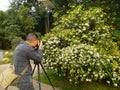 Jiangmen, China: photographers shooting flowers Royalty Free Stock Photo