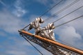 Jib boom with reefed sails on the bow of a historic sailing ship Royalty Free Stock Photo