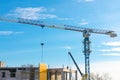 Jib crane. Construction crane against blue sky