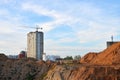 Jib tower crane and new residential buildings at a construction site on the blue sky background Royalty Free Stock Photo