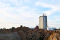 Jib tower crane and new residential buildings at a construction site on the blue sky background Royalty Free Stock Photo