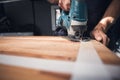 Jigsaw in action a wooden countertop Royalty Free Stock Photo