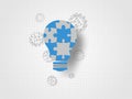 Jigsaw in the lightbulb shape and 3d gears on grid background represent new idea and innovation concept. Technology Background.