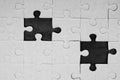 Missing jigsaw puzzle pieces in unfinished work. Royalty Free Stock Photo