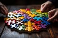 Jigsaw puzzle completed by connected hands, exemplifying the value of teamwork Royalty Free Stock Photo