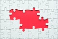 Jigsaw puzzle game piece on red background for business theme design Royalty Free Stock Photo