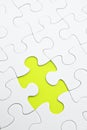 Jigsaw puzzle with green piece