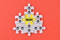 Jigsaw puzzle with group of workers symbols. Search for skillful and talented workers. Recruitment of entire formed teams of