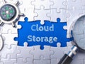 Jigsaw puzzle piece with a blue paper background, illustrating the concept of cloud storage Royalty Free Stock Photo