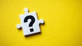 Jigsaw puzzle piece displaying a question mark, symbolizing a problem, doubt, and the quest for solutions Royalty Free Stock Photo