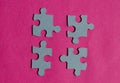 Jigsaw puzzle pieces on bright pink background Royalty Free Stock Photo