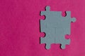 Jigsaw puzzle pieces on bright pink background Royalty Free Stock Photo