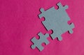 Jigsaw puzzle pieces on bright pink background Royalty Free Stock Photo