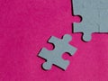 Jigsaw puzzle pieces on bright pink background Royalty Free Stock Photo