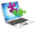 Jigsaw puzzle pieces flying out of laptop computer Royalty Free Stock Photo