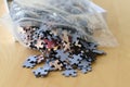 Jigsaw puzzle pieces out of the plastic bag Royalty Free Stock Photo