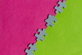 Jigsaw Puzzle pieces on pink and green background Royalty Free Stock Photo