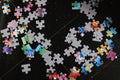 Jigsaw puzzle pieces put together on a black background Royalty Free Stock Photo