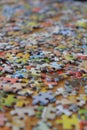 Jigsaw puzzle pieces scattered across a tabletop