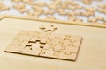 Jigsaw puzzle pieces on wooden background Business concept Selective focus Royalty Free Stock Photo