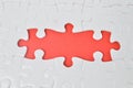 Jigsaw puzzle on a red background. The business concept, for commercials and business cards design