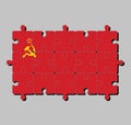 Jigsaw puzzle of Soviet Union flag, a plain red flag with a golden hammer and sickle and a gold-bordered red star.