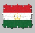 Jigsaw puzzle of Tajikistan flag in a red white and green; charged with a crown surmounted by an arc of seven stars.