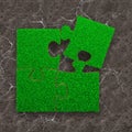 Four jigsaw puzzles with green grass Royalty Free Stock Photo