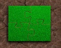 Four jigsaw puzzles with green grass Royalty Free Stock Photo