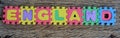 Jigsaw written England word on wood background