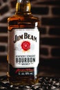 Jim Beam bourbon bottle on an iron grating