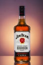 Jim Beam bourbon whiskey on gradient background.