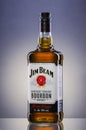 Jim Beam bourbon whiskey on gradient background.