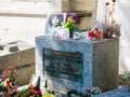 Jim Morrison grave in Pere-Lachaise cemetery, Paris. Each year thousands fans and curious visitors come to pay homage to Jim