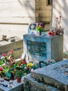 Jim Morrison grave in Pere-Lachaise cemetery, Paris. Each year thousands fans and curious visitors come to pay homage to Jim