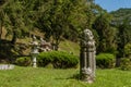 Stone lotus flower, stone lantern and sitting Buddha