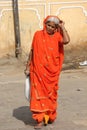 JIndian woman with an orange vivid veil