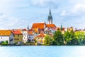 Jindrichuv Hradec cityscape. Church of the Assumption of the Virgin Mary and Vajgar pond in the foreground. Czech