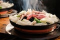 Jingisukan or Genghis Khan, Japanese Grilled Mutton on a Convex Metal Skillet Royalty Free Stock Photo