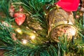 Jingle bell, Christmas tree branches with blurred background. Royalty Free Stock Photo