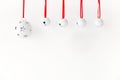 Jingle Bells with Ribbon Hanging in front of White Background Royalty Free Stock Photo