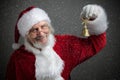 Jingle bells. Santa Claus holding metal bell in his hand