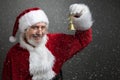 Jingle bells. Santa Claus holding metal bell in his hand