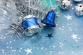 jingle bells and silver drum on blue glitter christmas background with star confetti Royalty Free Stock Photo