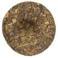 Jingmai Gu Shu Huang Pian Raw Puerh tea in round shape isolated