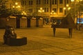 Jirasek square Jiraskovo namesti at summer night. Modern art sculpture of a man in thought and one piano