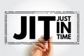 JIT Just in time - inventory management method in which goods are received from suppliers only as they are needed, acronym text