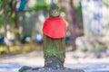 Jizo wearing a red vest
