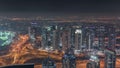 JLT and Dubai marina skyscrapers near Sheikh Zayed Road aerial night timelapse. Residential buildings Royalty Free Stock Photo